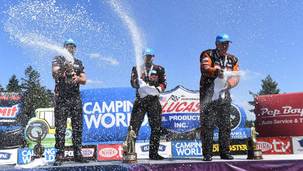 Sunday's NHRA winners at Seattle celebrate (from left): Gaige Herrera (Pro Stock Motorcycle), Steve Torrence (Top Fuel) and Tim  Wilkerson (Funny Car). Photo courtesy NHRA.